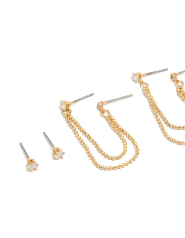 Crafted from gold plated metal with double layered beaded chains, cubic zirconia, crystal details, this statement 3-pack earring set offers close up view