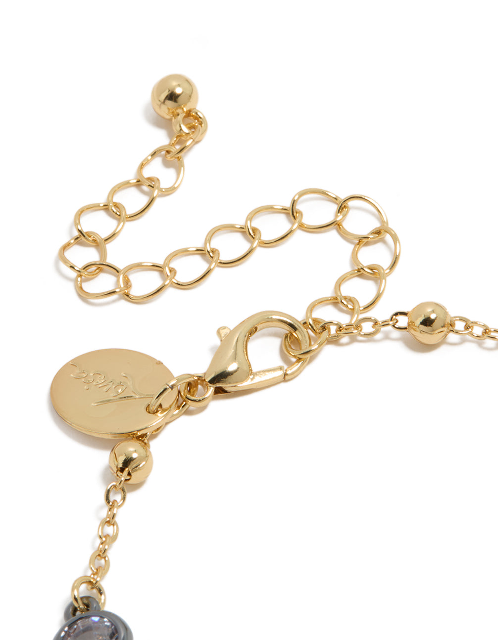 Mixed metal bracelet with gold plated lobster clasp, adjustable extender chain, ball accents, and cubic zirconia stones closure detail view