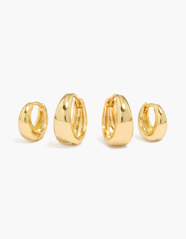 Showcasing small and medium oval huggie earrings in a statement 2-pack front view