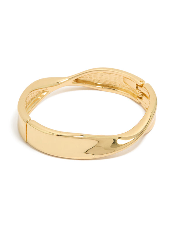 Showcasing a gold plated twisted thick bangle with chunky design in gold front view