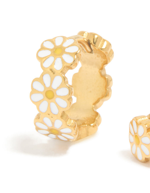Crafted from gold plated surgical steel, these kids enamel daisy hoop earrings feature white and yellow floral patterns in close up view