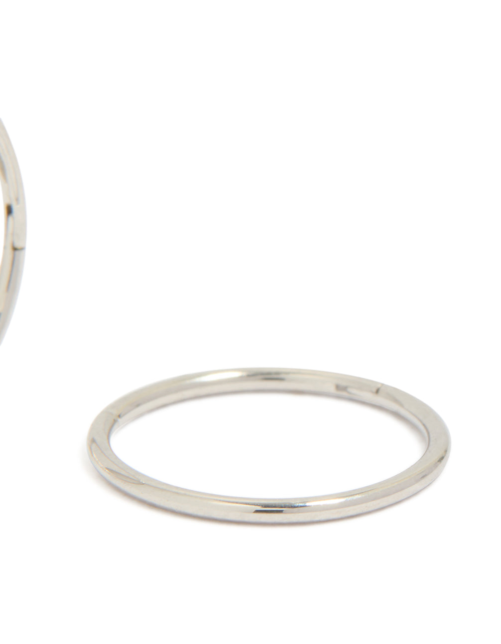 Featuring kids surgical steel sleeper earrings with dainty, hoop closure in silver post detail view
