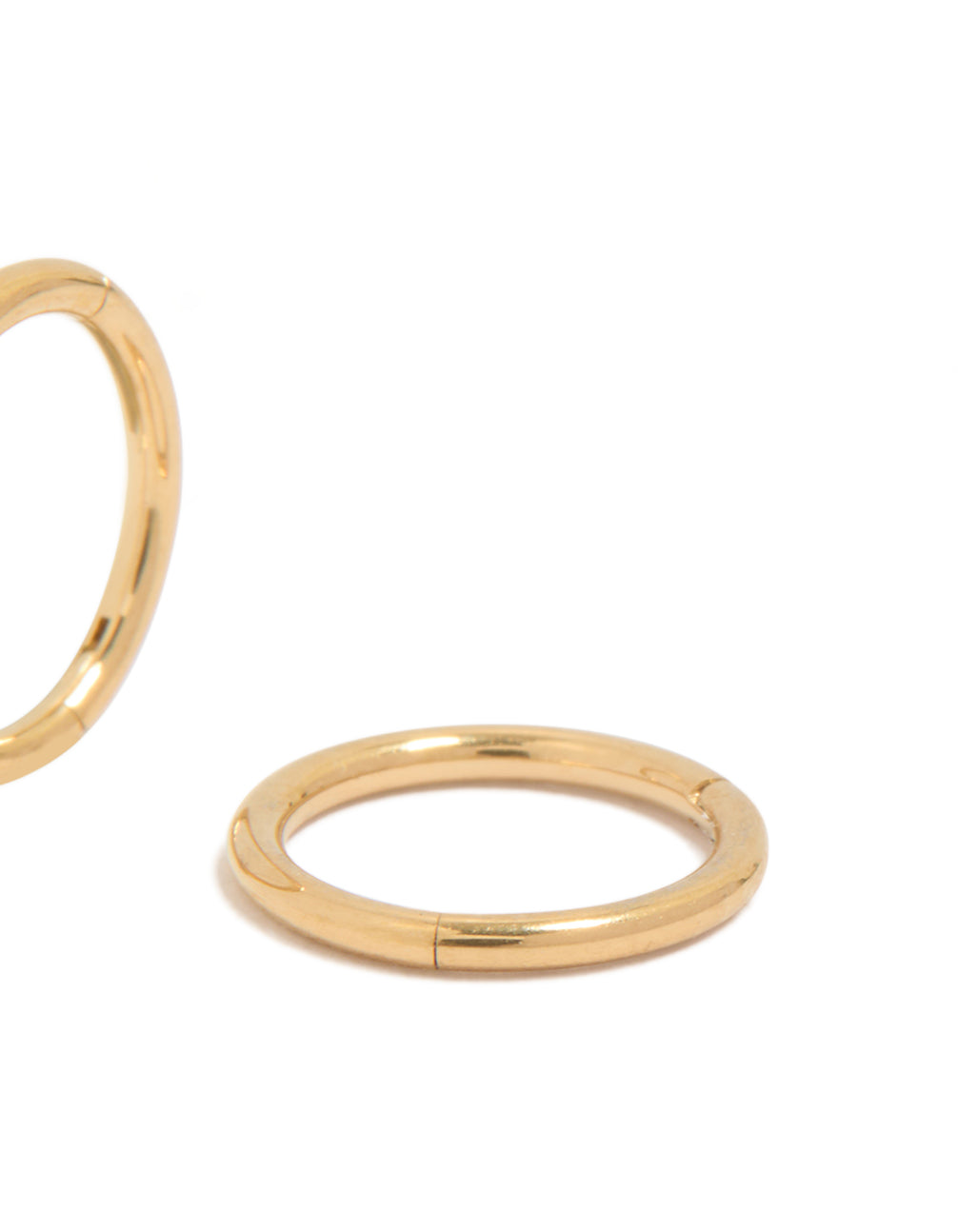 Featuring kids surgical steel sleeper earrings in gold plated material displaying closure mechanism post detail view