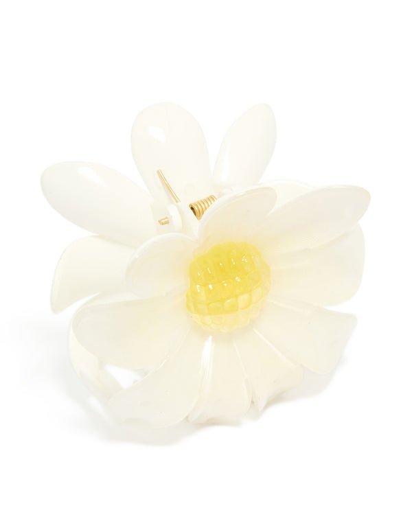 Showcasing a glossy daisy flower claw clip with in ivory, yellow side view