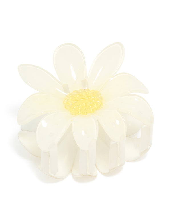 Featuring a glossy daisy flower claw clip in ivory, yellow front view