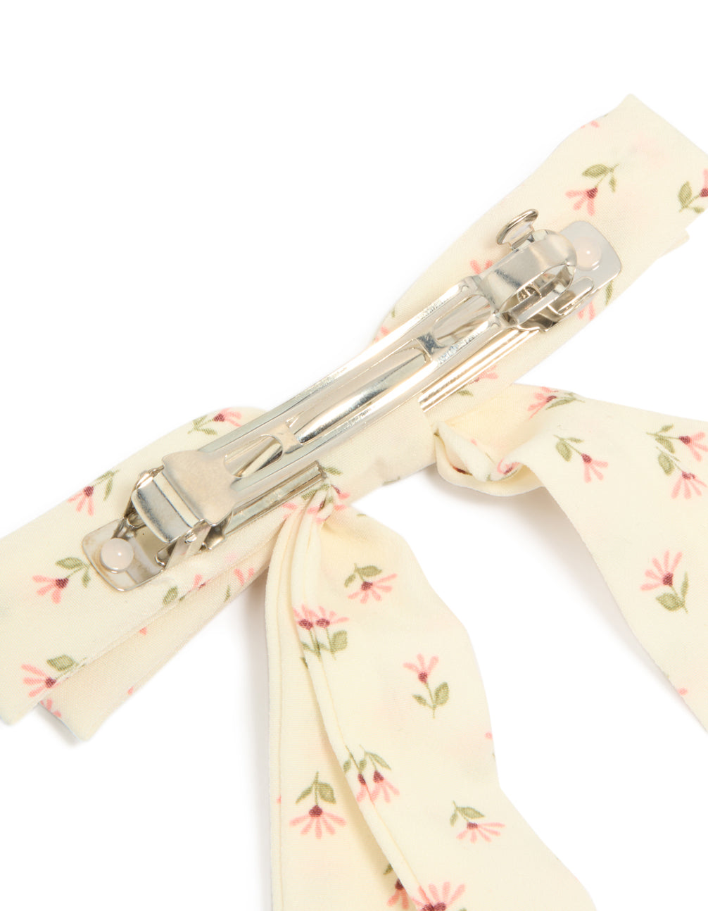 Crafted from cream pink flowers printed fabric, this bow clip reveals metal clasp hardware in ivory and light pink with olive drab leaf accents detail view