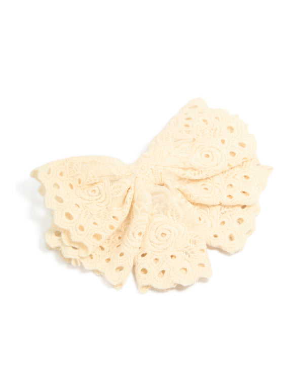 Cream broderie triple layered fabric bow hair clip with floral detailing front view