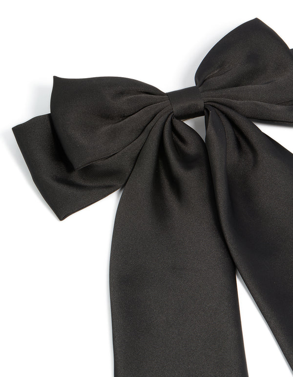 Featuring a bow design in solid black this hair clip side view