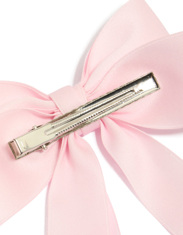 Featuring a bow in solid print with light pink statement hair clip detail view