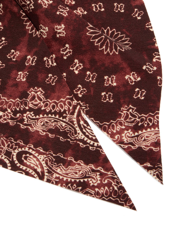 Striking bow hair clip showcasing intricate paisley print in maroon, brown statement styling detail view