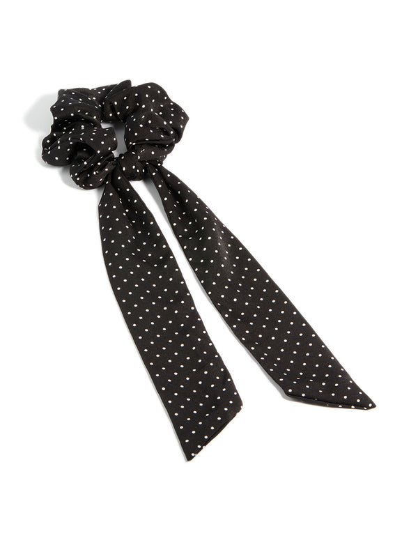 Showcasing a polkadot fabric micro spot long scarf in black and white front view