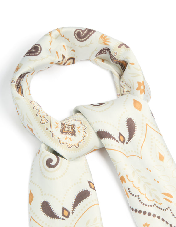 Featuring a white paisley swirl printed fabric scarf in ivory, brown, and peachpuff detail view