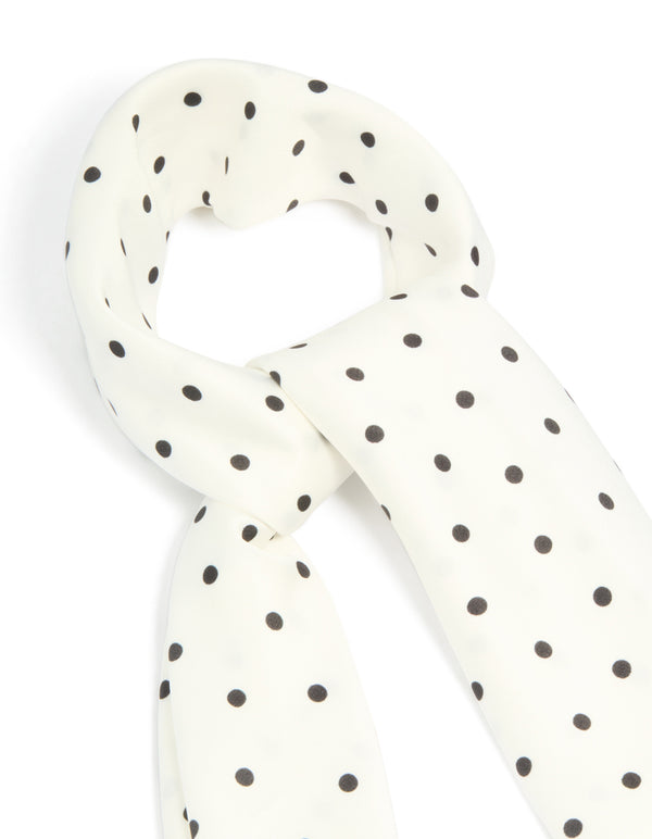 Displaying a polkadot fabric scarf in white and black detail view