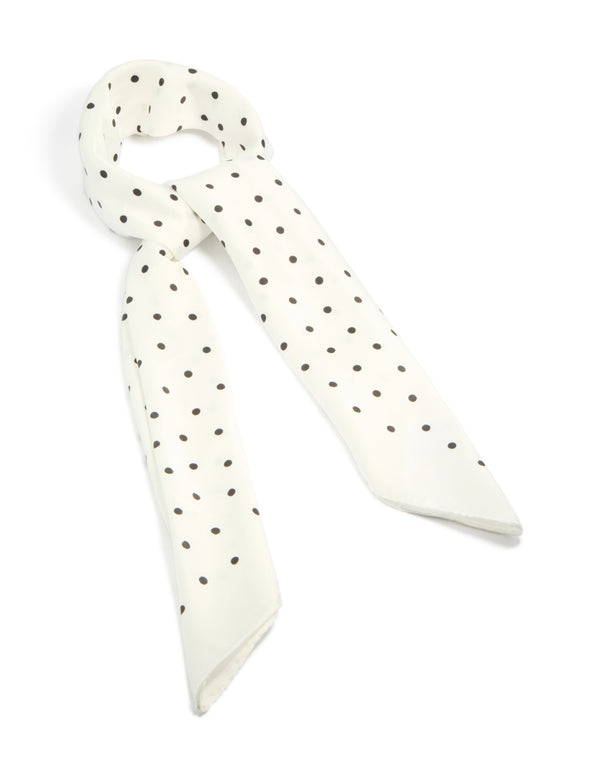 Showcasing a polkadot fabric scarf in white and black front view