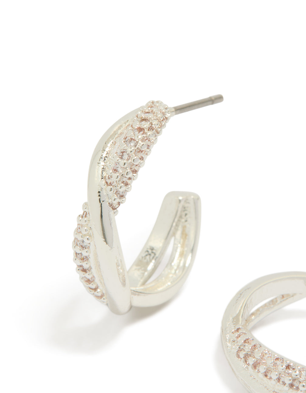 Detailed silver plated cubic zirconia twist hoop earrings close up view