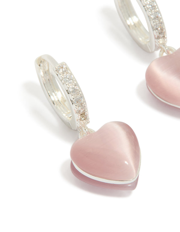Elegant dainty hoop earrings with heart drop, crafted from silver plated cubic zirconia in light pink close up view