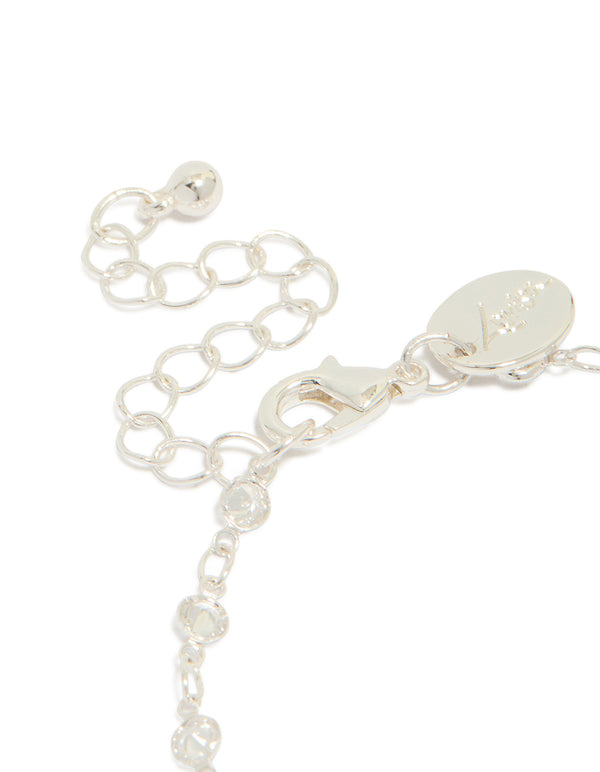Highlighting a silver plated cubic zirconia round dainty chain bracelet closure detail view