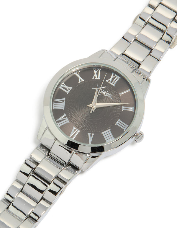 Discover a men's silver classic round watch with roman numeral black dial, link band, and formal analog design watch face detail view