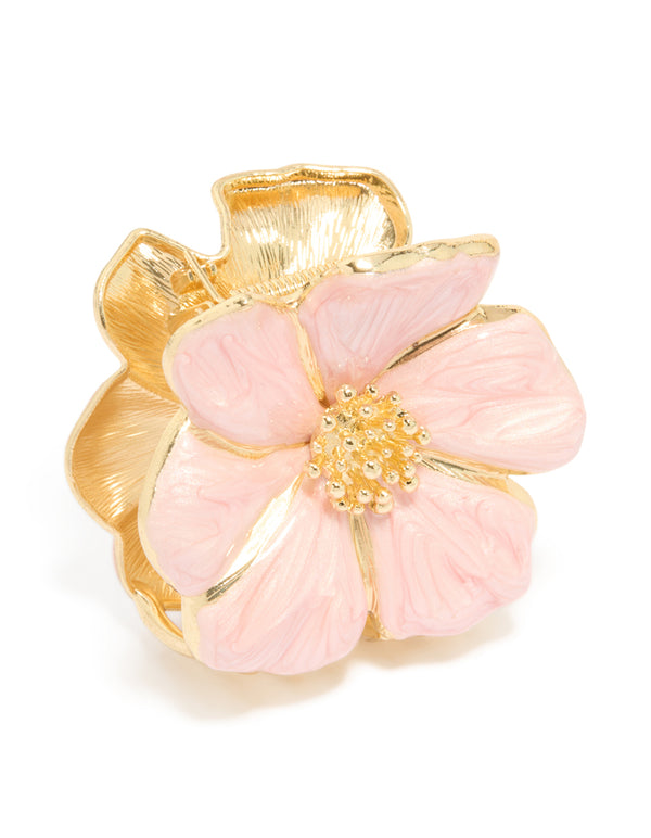 Discover a floral enamel blossom hair claw clip in light pink and gold side view