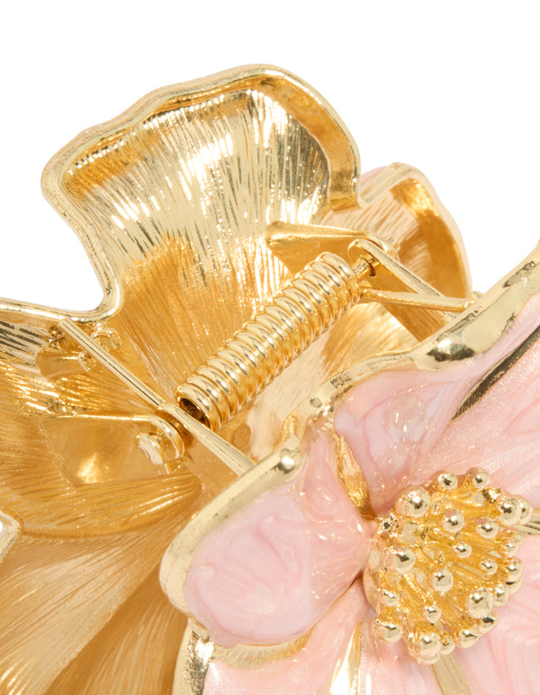Elegant floral enamel blossom hair claw clip in light pink and gold detail view