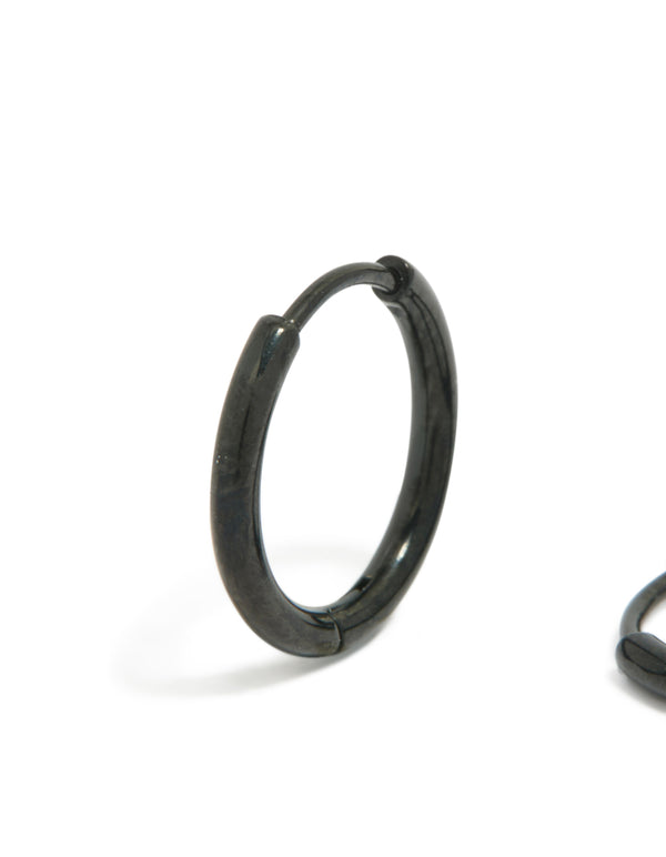 This pair showcases chunky stainless steel huggie hoop clicker earrings in black, crafted from waterproof materials close up view