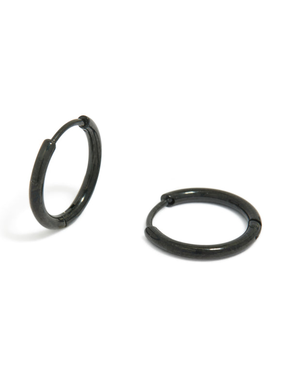 Featuring chunky stainless steel huggie hoop clicker earrings in black, crafted from waterproof materials front view