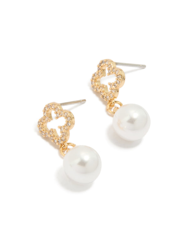 Showcase these floral pearl cubic zirconia outlined flower gold plated earrings in white and gold front view