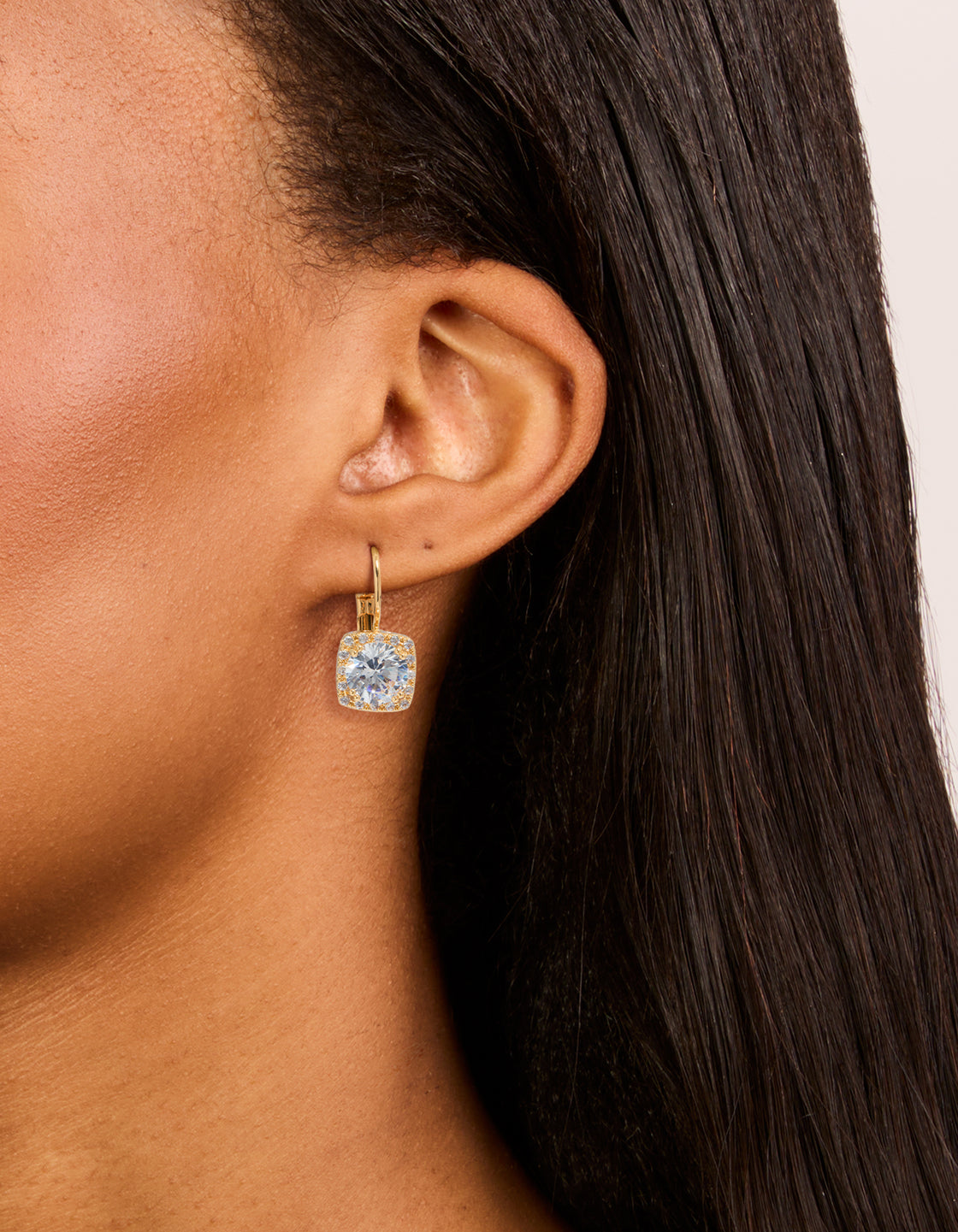 Showcasing gold plated cubic zirconia large square hook drop earrings in clear on ear view