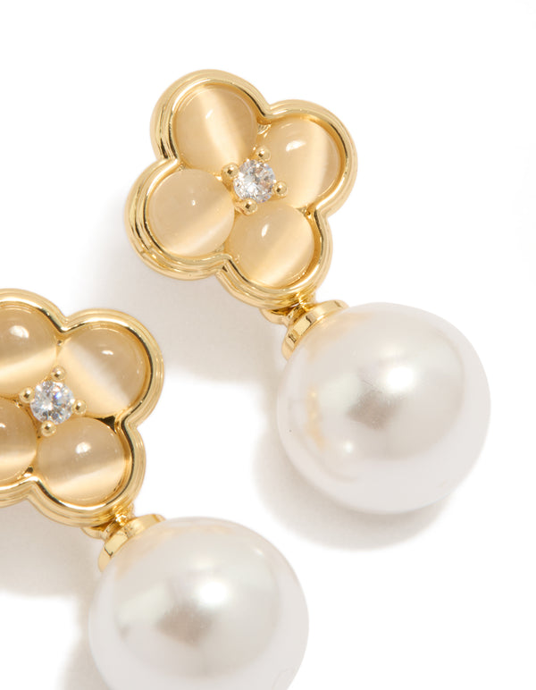 Featuring gold plated pearl and flower drop earrings with floral design in white and ivory tones detail view