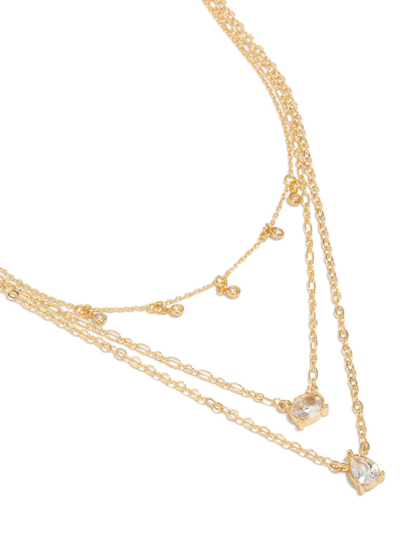 Discover this charm necklace featuring gold plated cubic zirconia in a triple layered design close up view