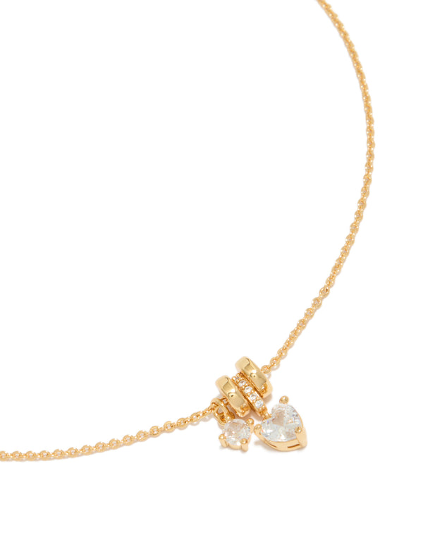 Elegant gold plated cubic zirconia heart and circle pendant necklace featuring charm with crystal accents close up view