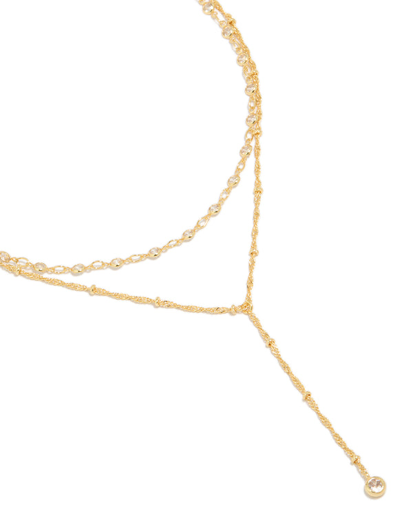 Showcasing a gold plated cubic zirconia bezel layered chain Y-necklace with featuring balls details in dainty style close up view