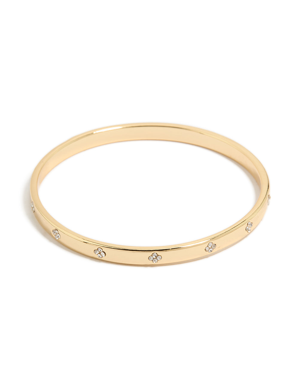 Crafted from gold plated metal, this cubic zirconia flowers bezel set bangle features a floral pattern in clear and gold tones front view