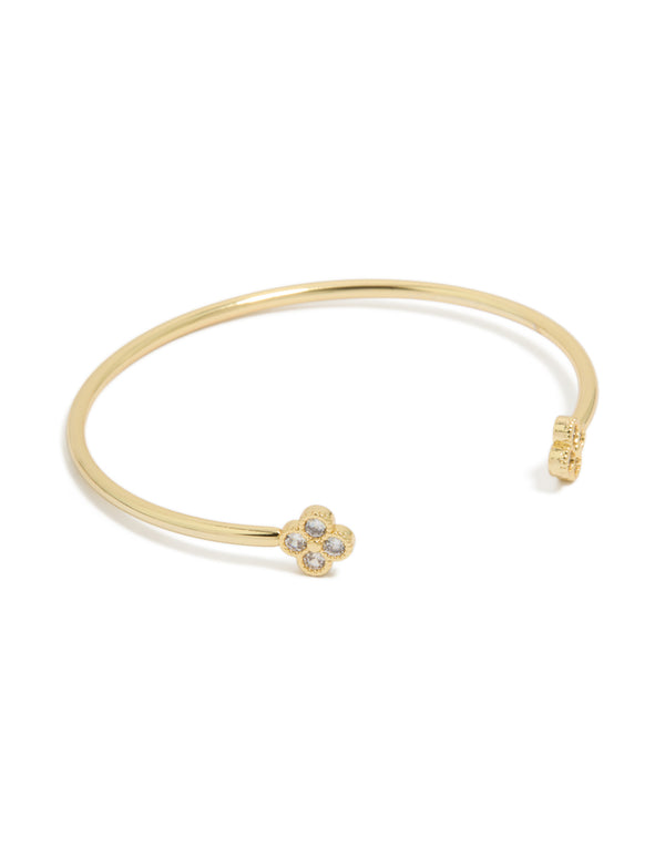 Showcasing a floral statement wrist cuff crafted from gold plated metal with cubic zirconia front view