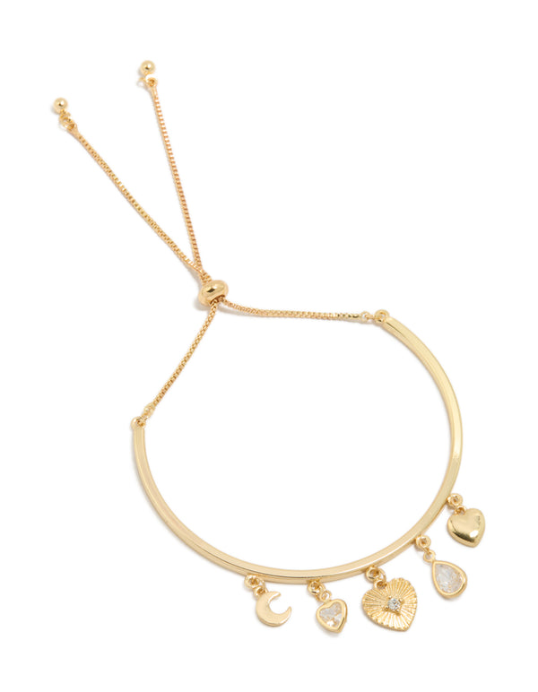 Showcasing a gold plated bangle with celestial moon and heart charm details in gold front view