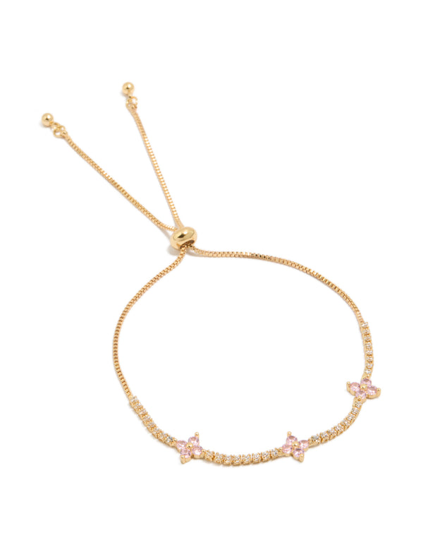 Featuring a gold plated toggle bracelet with clear and pink cubic zirconia flowers front view