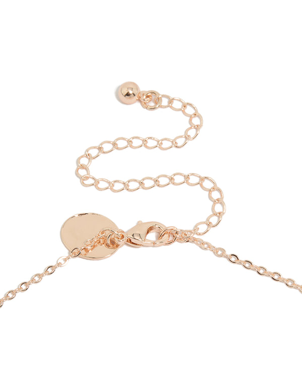 Highlighting a vine spaced necklace with floral and leaf elements, crafted from cubic zirconia in rose gold plated finishes, statement styled clasp detail view
