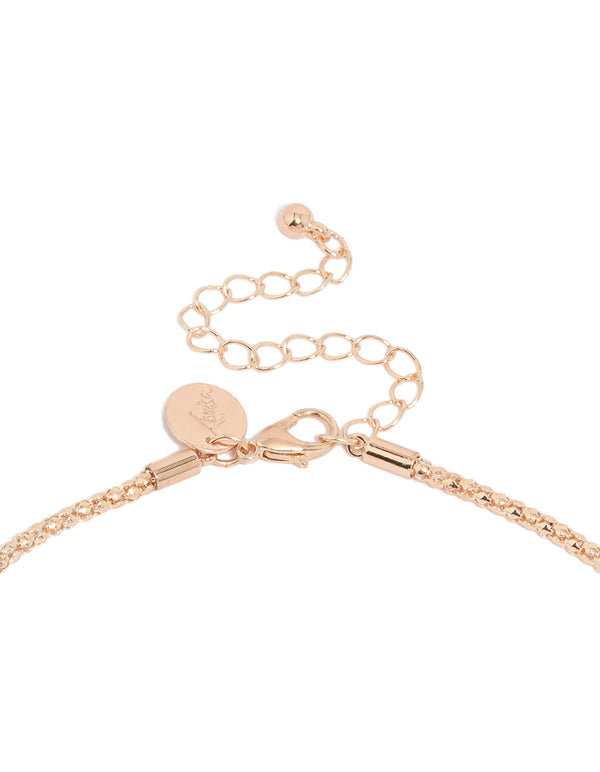 Featuring pearl details, this rose gold plated twist chain adjustable Y-necklace in statement design clasp detail view