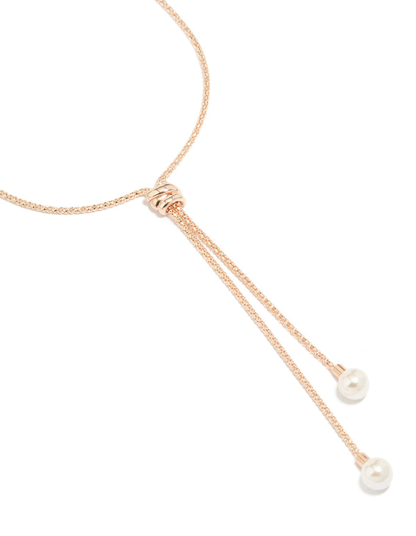 Crafted from rose gold plated metal, this pearl twist chain adjustable Y-necklace features statement details close up view