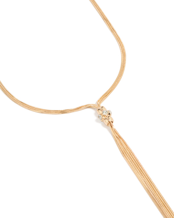 Showcasing a gold long snake tassel necklace close up view