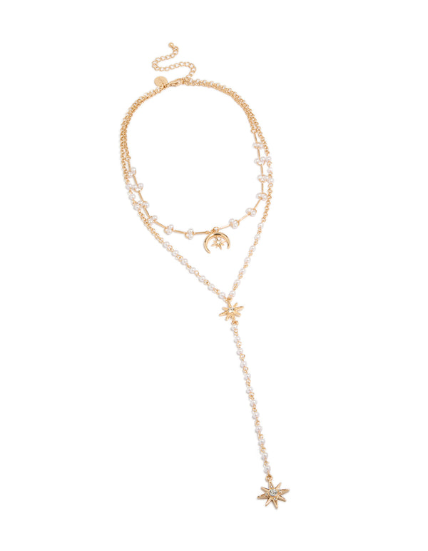 Beautifully designed layered Y-necklace with celestial charms including moon and stars adorned with pearls in gold plated finish creating a statement piece front view