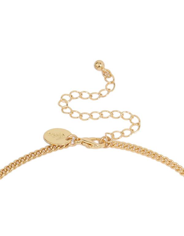 Stunning shell and tassel necklace in gold with ocean inspired design clasp detail view