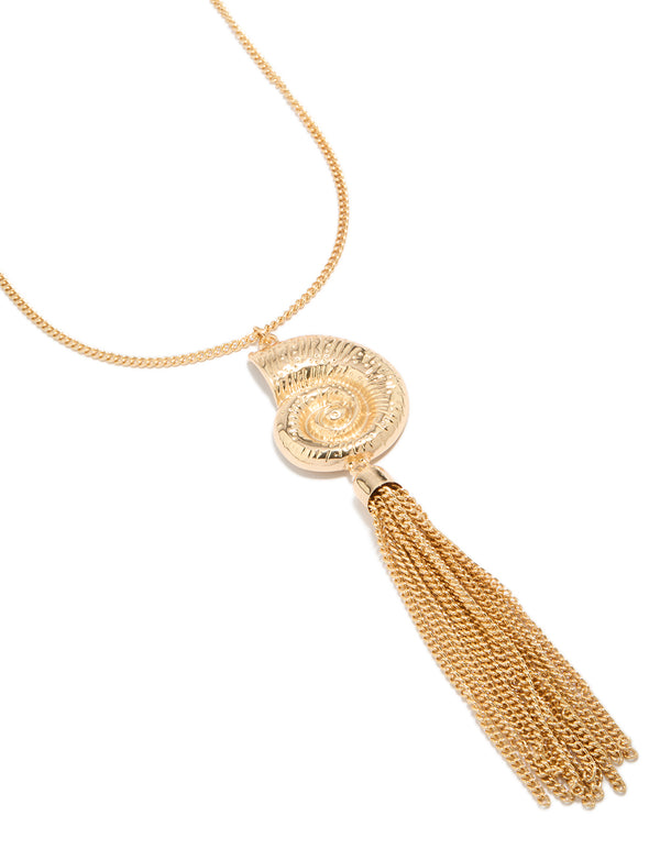 Beautifully crafted shell and tassel necklace in gold featuring ocean inspired design close up view