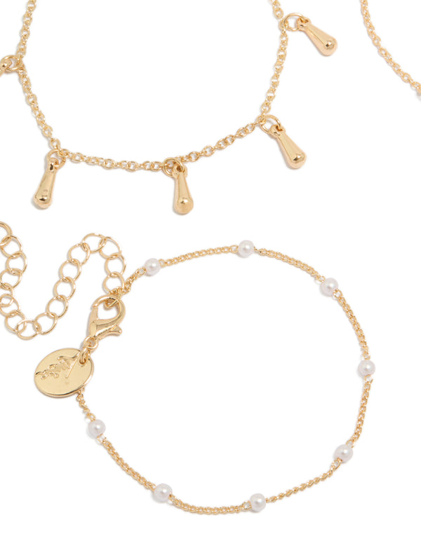 Featuring gold pearl and light blue cord bracelets in a 4-pack with celestial star, moon details close up view