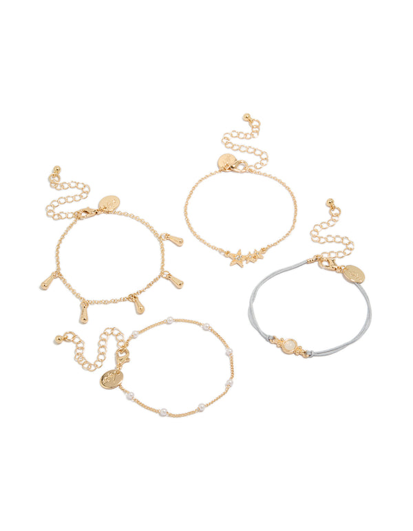 Showcasing a gold pearl and light blue cord bracelets in a 4-pack with celestial star, moon accents, and delicate design front view