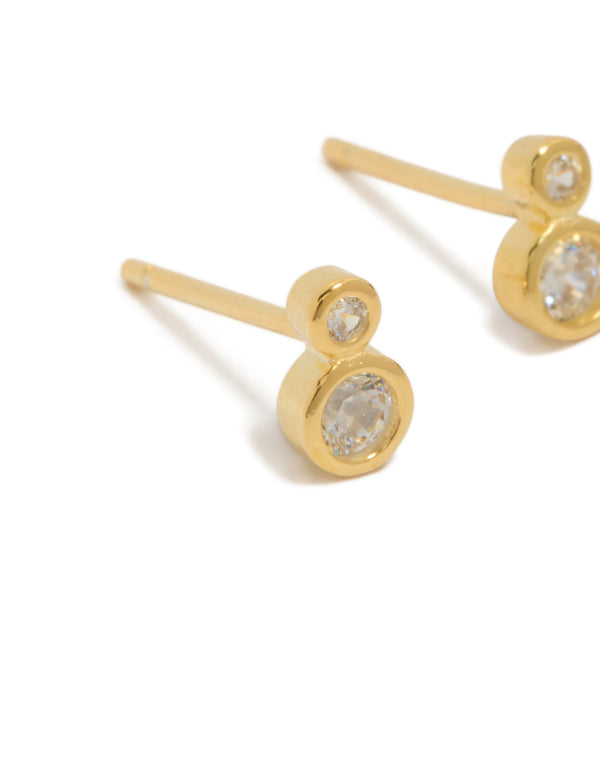 Presenting dainty stud earrings crafted from gold plated sterling silver with cubic zirconia in a double bezel setting close up view