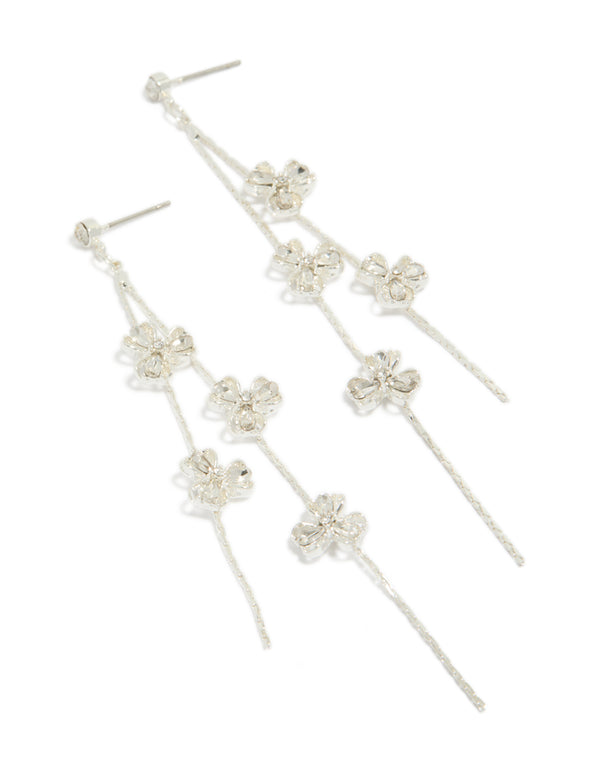 Showcasing dainty floral drop earrings in silver with delicate design and clear accents front view