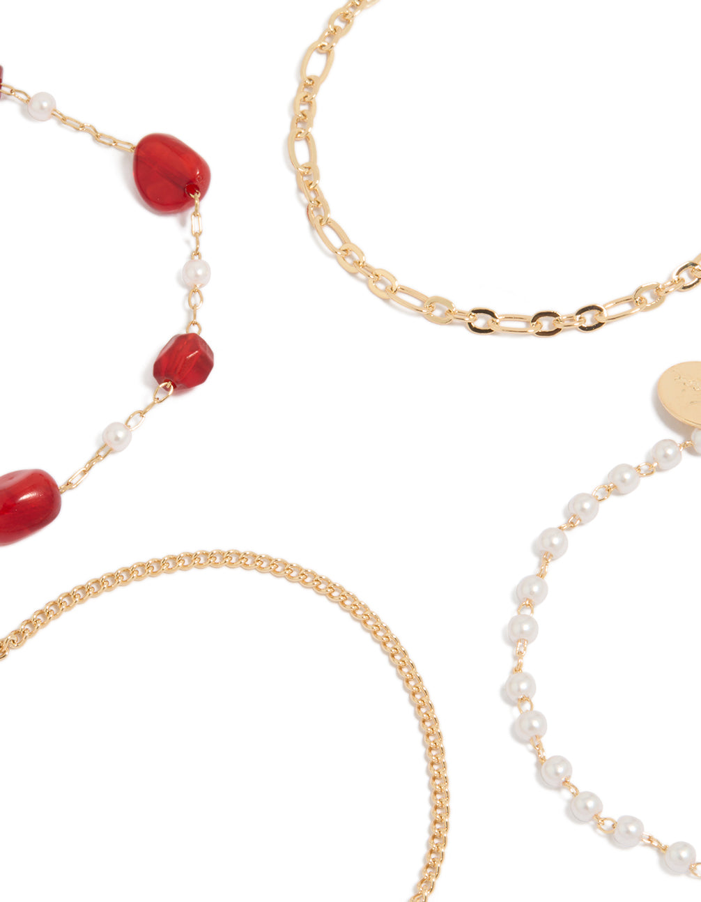 Highlighting gold dainty pearl and red beaded chain bracelets 4-pack close up view