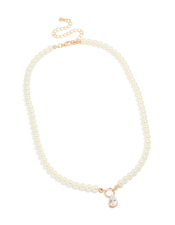 Featuring a gold cubic zirconia dainty pearl pendant necklace in a front view