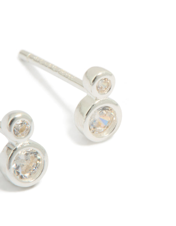Crafted from sterling silver cubic zirconia double bezel set stud earrings showcasing post detail view